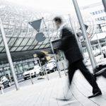 businessman with trolley at the airport, motion blurred